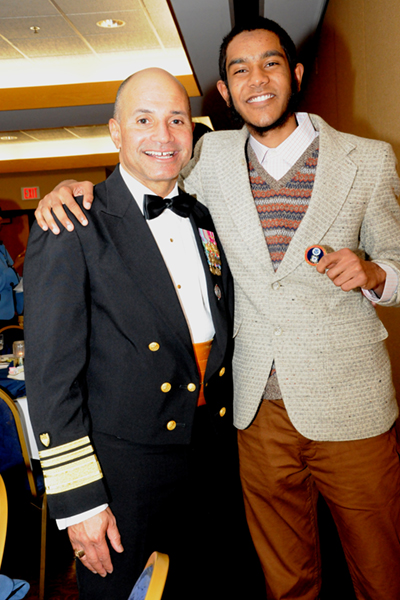 Alan Hai receives special coin from Vice Admiral Manson Brown, USCG